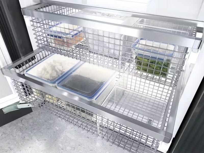 Miele MasterCool Freezer with spacious wire baskets, showcasing ample storage space and NoFrost technology to keep frozen holiday meals fresh and organized without ice build-up.